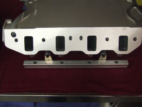 1971 Ford Mustang - This is a close-up view of an engine intake manifold and a separate fuel rail.