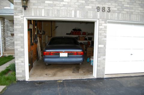 1985 Mercury Grand Marquis - This blue 1996 Mercury Grand Marquis is parked inside a garage, with the rear of the vehicle visible.