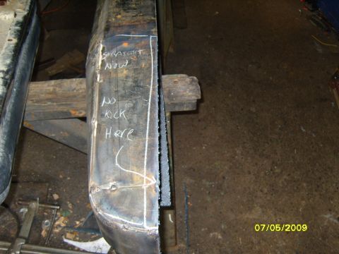 1989 Ford Bronco - Metal bumper section with chalk markings indicating fabrication or repair work.