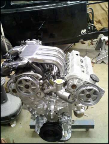 1994 Ford Probe - Engine assembly shown with polished intake and timing components.
