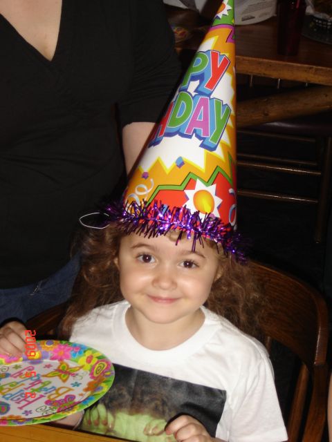 1993 Ford Bronco - A child celebrates with a festive party hat and plate, indicating a birthday event.