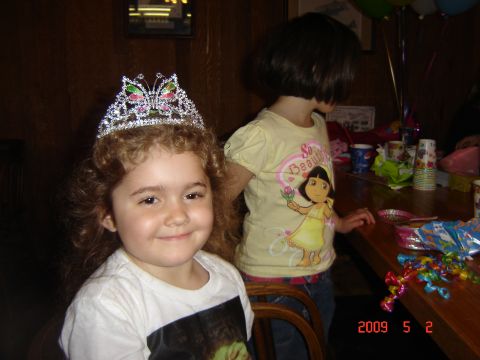 1993 Ford Bronco - A birthday party scene with two young girls, one wearing a tiara and the other a Dora the Explorer shirt.