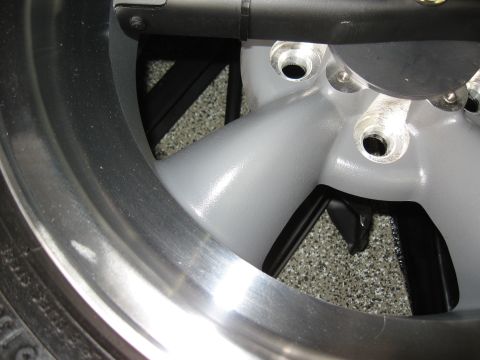 1968 Shelby GT500 - A detailed view of a vehicle's wheel and tire assembly, highlighting the rim and spoke design.