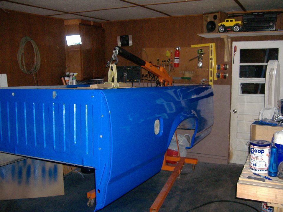 Blue 1992 Dodge Dakota truck bed on an engine hoist in a garage