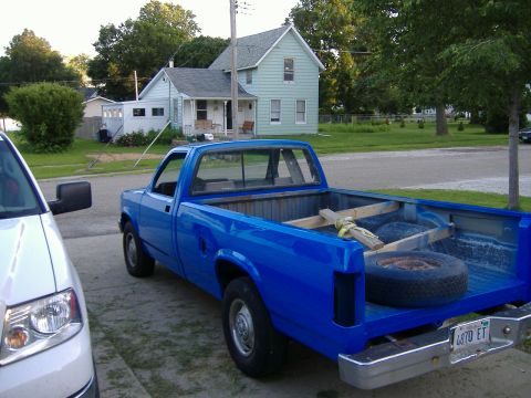 1992 Dodge Dakota - Blue 1992 Dodge Dakota pickup truck parked in a driveway, showing the rear and bed.