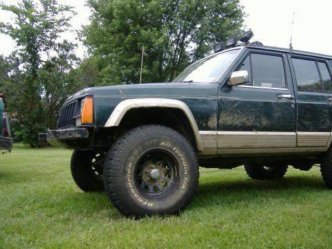 1993 Jeep Cherokee - This Jeep Cherokee appears to be an earlier model, likely from the mid-1980s, based on its body style.