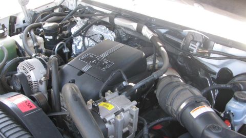 1996 Ford C-350 (Centurion Conversions) - Close-up view of a diesel engine's complex internal components and wiring.