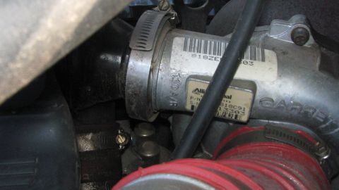 1996 Ford C-350 (Centurion Conversions) - Close-up view of a Garrett turbocharger with an Alliantel label, showing part numbers and a barcode.