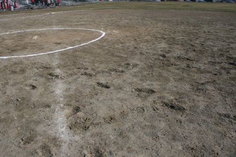 1990 Chevrolet Suburban - A view of a softball field, showing the dirt infield and base paths.