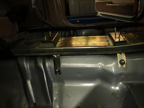 1999 Ford Crown Victoria - Custom metal bracing is installed on the vehicle's floor, suggesting modifications.