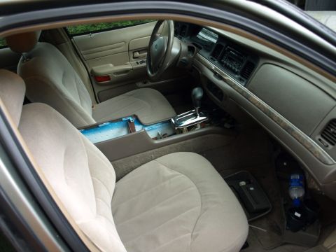 1999 Ford Crown Victoria - Finishing up after installing buckets. I was assured the wrinkles will go away.