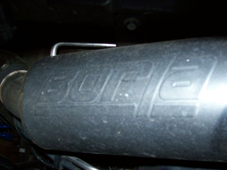 Exhaust muffler with embossed 'BORLA' logo. Part of a vehicle's exhaust system