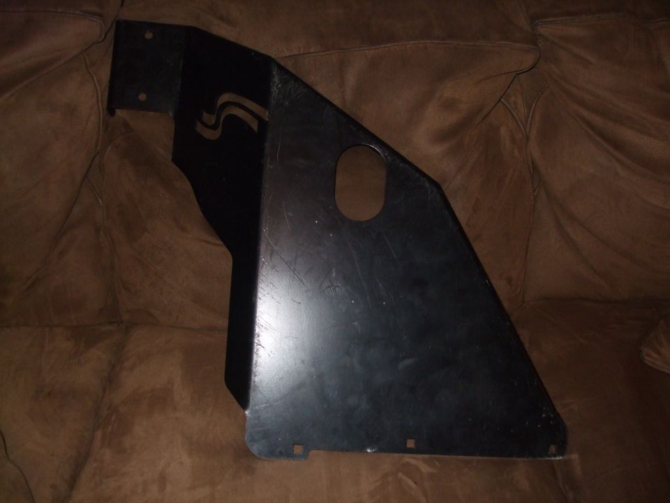 Black metal bracket with a cutout and a curved stripe design