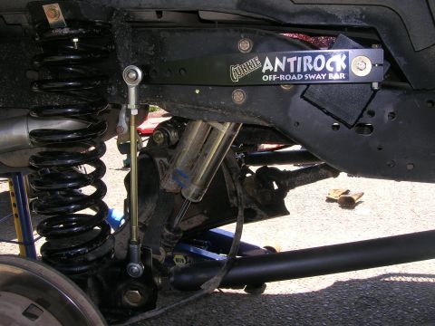 1996 Ford Bronco - Close-up of a Currie Antirock Off-Road Sway Bar installed on a vehicle's rear suspension system.