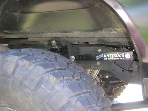 1996 Ford Bronco - Close-up of a Currie Antirock off-road sway bar installation.
