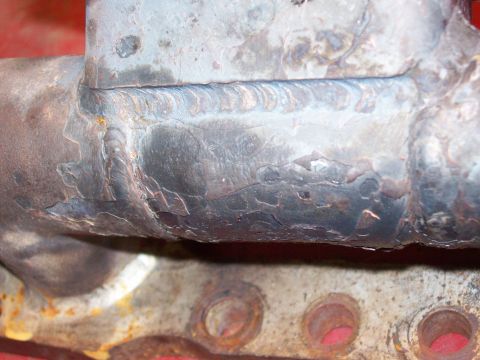 1986 Toyota Hilux - This image shows a close-up of a welded metal part, likely an exhaust manifold or similar component.