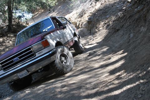 1996 Ford Bronco - This 1996 Ford Bronco navigates a steep, dusty off-road path.