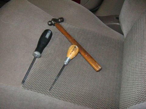 2003 Ford Taurus - Tools needed for the job: Phillips screwdriver, small hammer, and a pick/chisel/long metal stick.