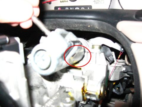 2003 Ford Taurus - The pin will stick through on this side. Position the pick/chisel/long stick on the pin and tap it with the hammer. DO NOT TAP TOO HARD! Th…