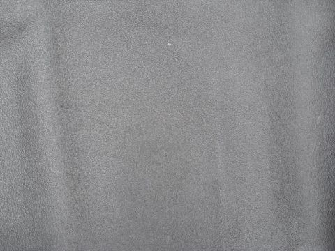 1963 Ford Galaxie - A close-up of a textured gray surface, possibly a car interior part, with a website logo visible.