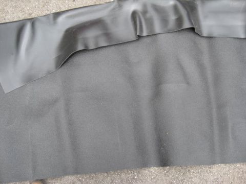 1963 Ford Galaxie - Black rubber matting, possibly for a car interior, is shown with a folded edge and textured surface.