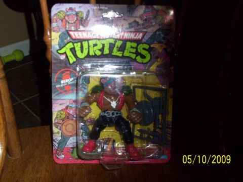 1991 Ford Bronco - Bebop action figure from Teenage Mutant Ninja Turtles, still in its original packaging.
