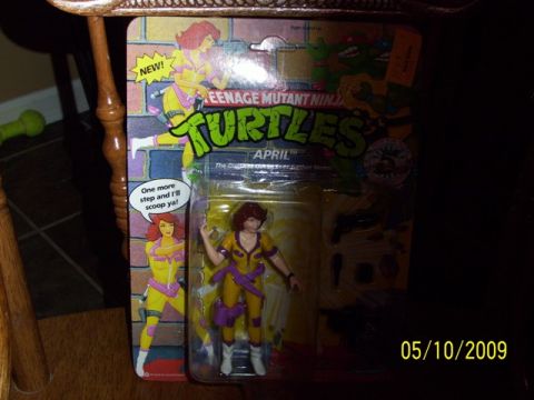 1991 Ford Bronco - April O'Neil action figure from Teenage Mutant Ninja Turtles, packaged with accessories.