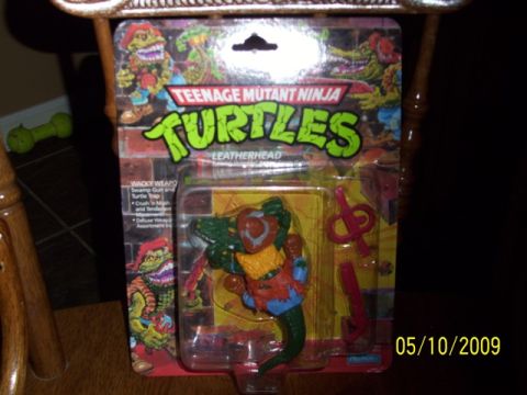 1991 Ford Bronco - Leatherhead action figure from Teenage Mutant Ninja Turtles, still in its original packaging.