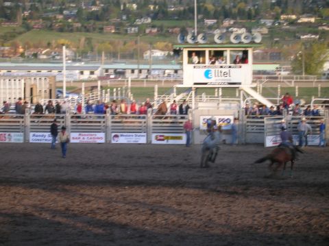 1996 Ford Bronco - A rodeo event is underway with participants and spectators gathered in the arena.