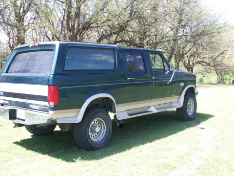 1995 Ford C-350 (Centurion Conversions) - This 1995 Ford C-350 Centurion Conversions pickup has an extended cab and a camper shell.