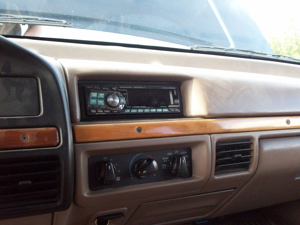 Dashboard interior showing an aftermarket stereo and climate controls