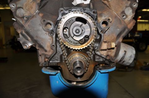 1996 Ford Bronco - Close-up of an engine's timing chain and gears, with part number FES-1 clearly visible on the camshaft sprocket.