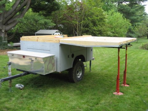 1996 Ford Bronco - A custom-built trailer with an extended pop-up camper top, set up on a grassy lawn.