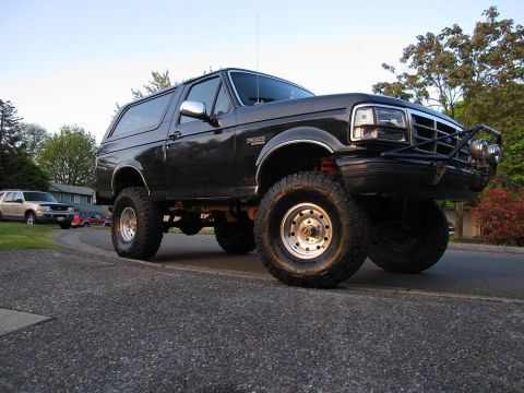 1992 Ford Bronco - This lifted 1992 Ford Bronco has large off-road tires and a custom front brush guard.