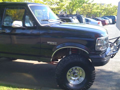 1992 Ford Bronco - This 1992 Ford Bronco features a custom front bumper and lifted suspension, giving it an aggressive stance.