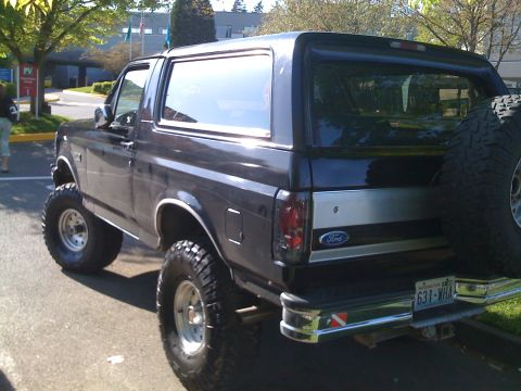 1992 Ford Bronco - This 1992 Ford Bronco is seen from the rear, a spare tire on the back.