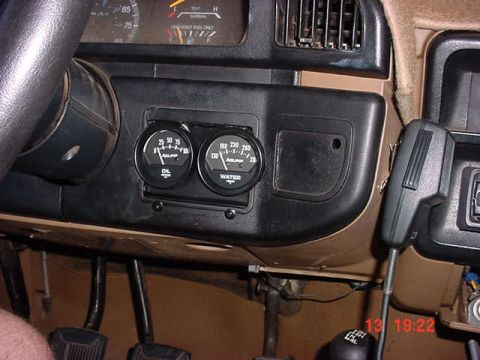 1989 Ford Bronco - Cut out the stock coin tray and trimmed to fit...