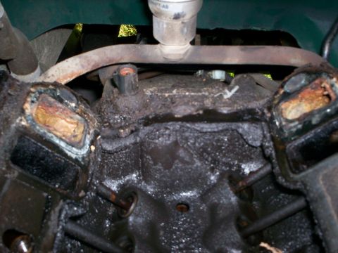 1990 Ford Bronco - The engine block shows significant corrosion and buildup around the cylinder head mating surfaces.