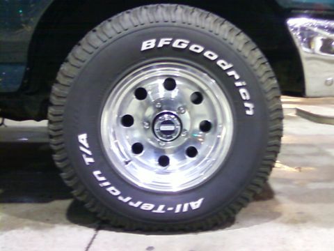 1990 Ford Bronco - Close-up of a vehicle's wheel and tire, showing BFGoodrich All-Terrain T/A branding.