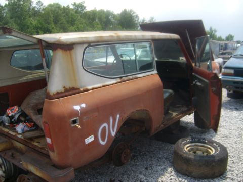 1994 Ford Bronco - Junkyard International Harvester Scout II, likely a 1971 model, sits on a trailer with parts missing.