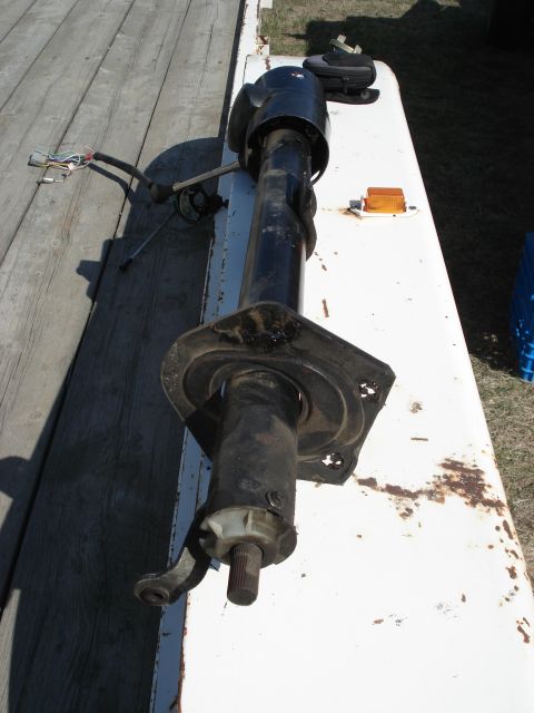 1979 Ford Bronco - A black steering column tilt mechanism with a visible wiring harness is shown, likely a replacement part.