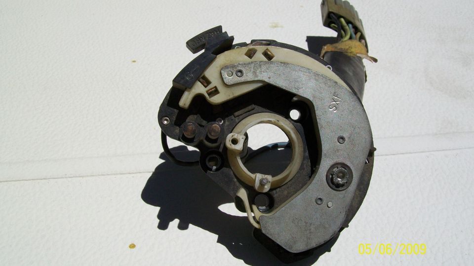 Turn signal switch assembly with visible 'SXF' marking