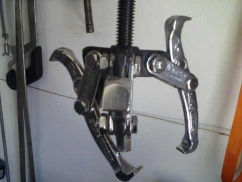 1986 Ford Bronco - Close-up of a gear puller tool, a common automotive repair implement.
