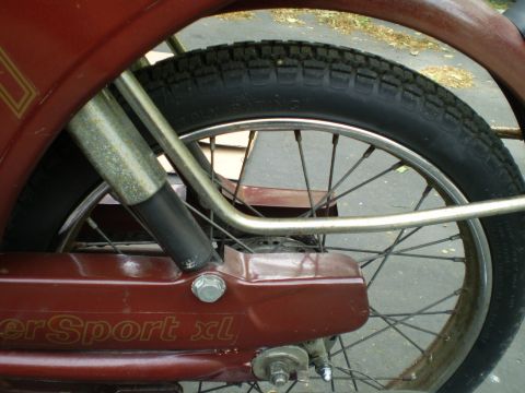 1981 Garelli Rally Sport - Close-up of the rear wheel and fender assembly on a moped, showing "Sport xl" text.
