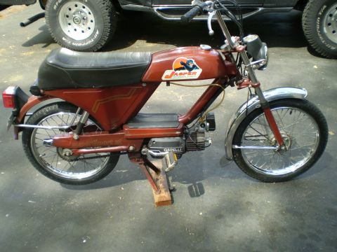 1981 Garelli Rally Sport - Red moped with Jasper logo and "Garelli" engine cover, parked outdoors.