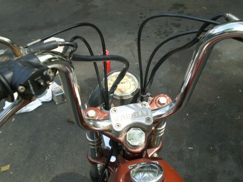 1981 Garelli Rally Sport - The handlebars and instrument cluster of a motorcycle are shown in this close-up view.