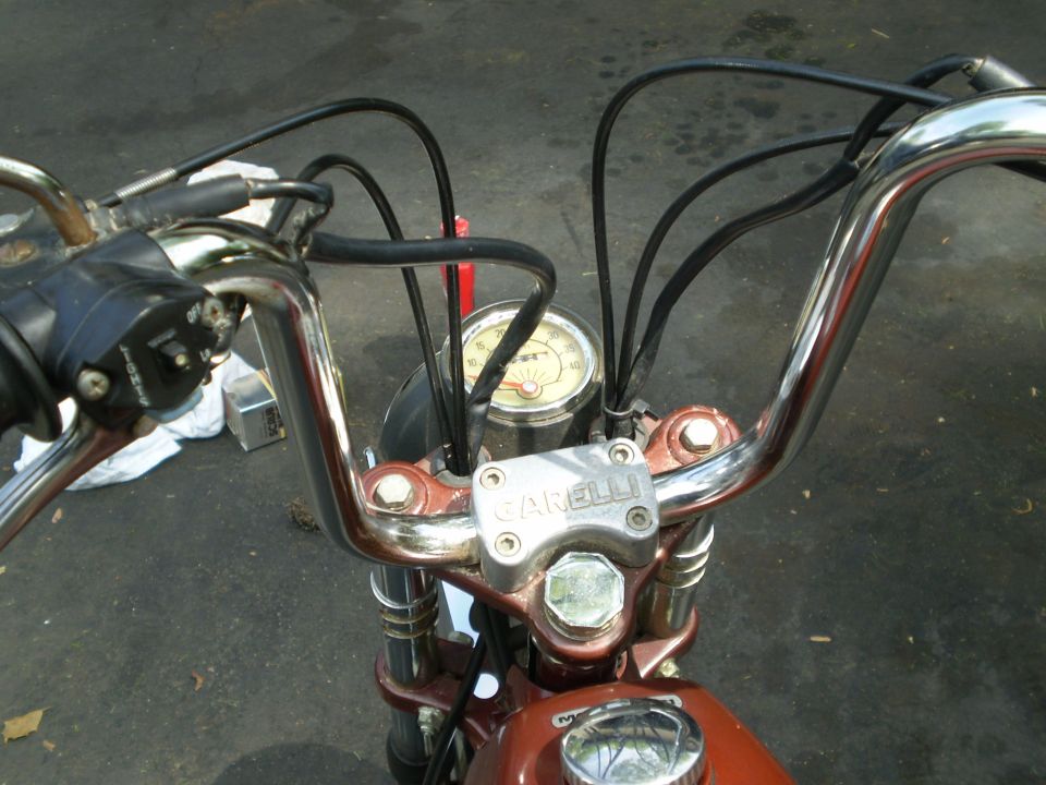 Moped handlebars with GARELLI top clamp, small speedometer and chrome dome nut