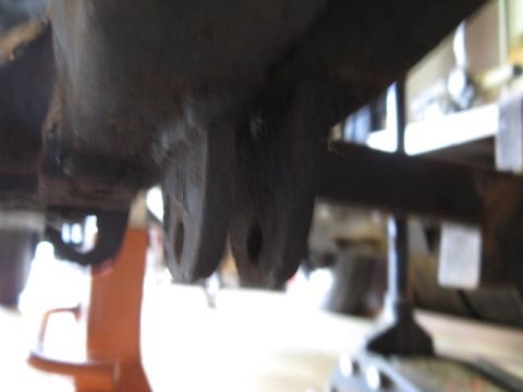 1963 Ford Galaxie - Close-up of rusty suspension components supported by jack stands, with a Supermotors.net watermark.