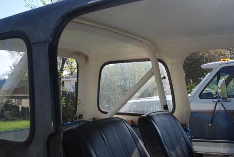 1981 Jeep CJ7 - Interior view of a 1981 Jeep CJ7, highlighting the seats and roll bar structure.