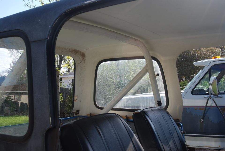 Interior view of a 1981 Jeep CJ7 showing seats and roll bar